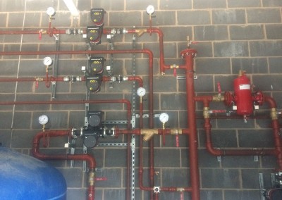 Standard plant room with vertical header, shut pump, VT & CT circuits etc at Eversfield Prep School